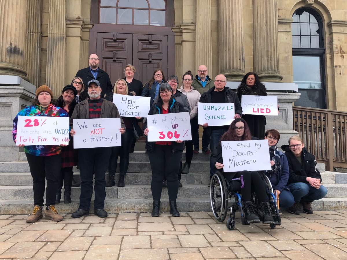 Family members and patients of those suffering from a mystery neurological disease gather in Fredericton, Tuesday, March 28. The group is calling for an investigation into potential environmental causes afflicting New Brunswick residents for more than two years.