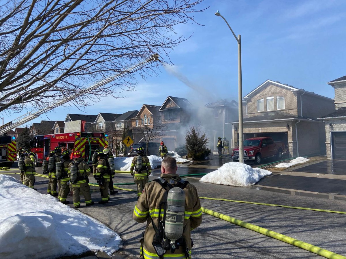 Crews are battling a house fire in Richmond Hill on Monday, March 20, 2023.