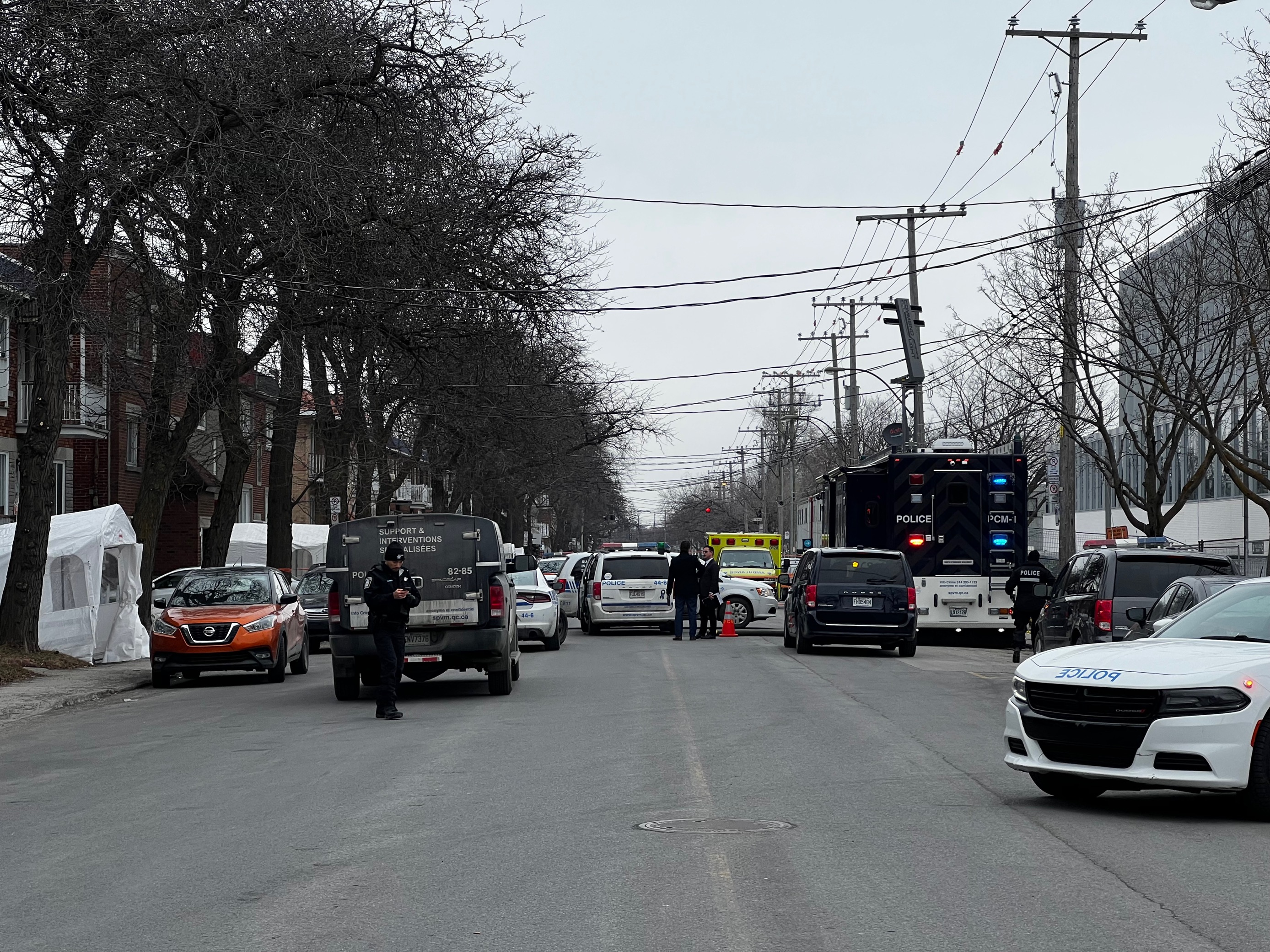 The scene of the triple-homicide is pictured near the intersection of Viau and Belanger Streets in the city's Rosemont-La Petite-Patrie borough. Friday, March 17, 2023.