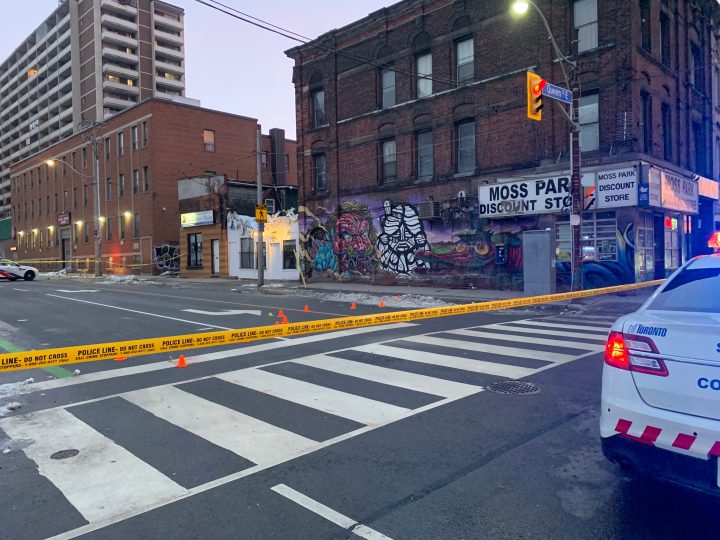Police on scene following a fatal stabbing near Queen and Sherbourne streets on March 6, 2023.
