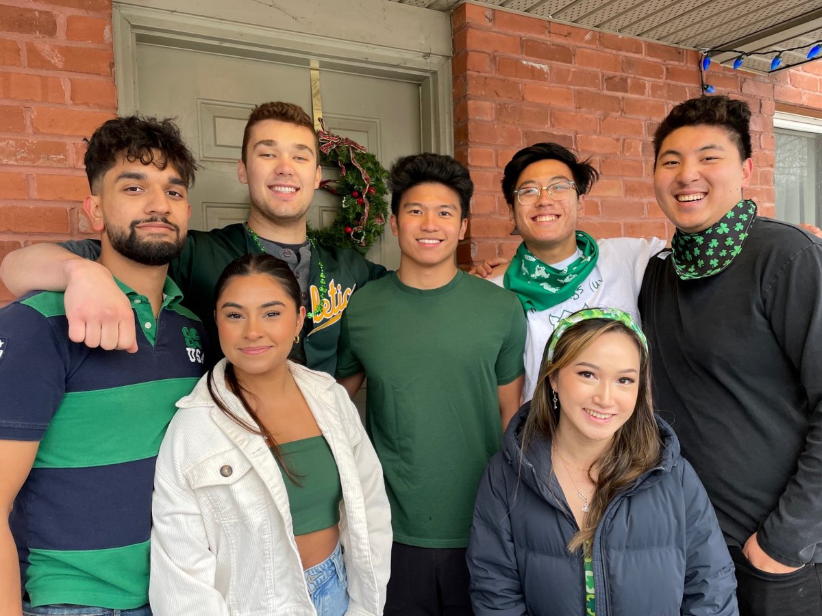 Lots of Western University students, including Mike Oxmoal, second from the top left, were on Broughdale Avenue Friday to celebrate St. Patrick's Day in London, Ont. 