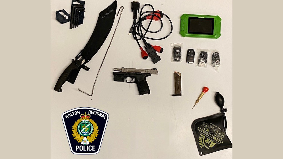Halton police seized a loaded handgun, a large machete style knife, and tools for reprogramming vehicles from three auto theft suspects in a raid on Mar. 2, 2023.