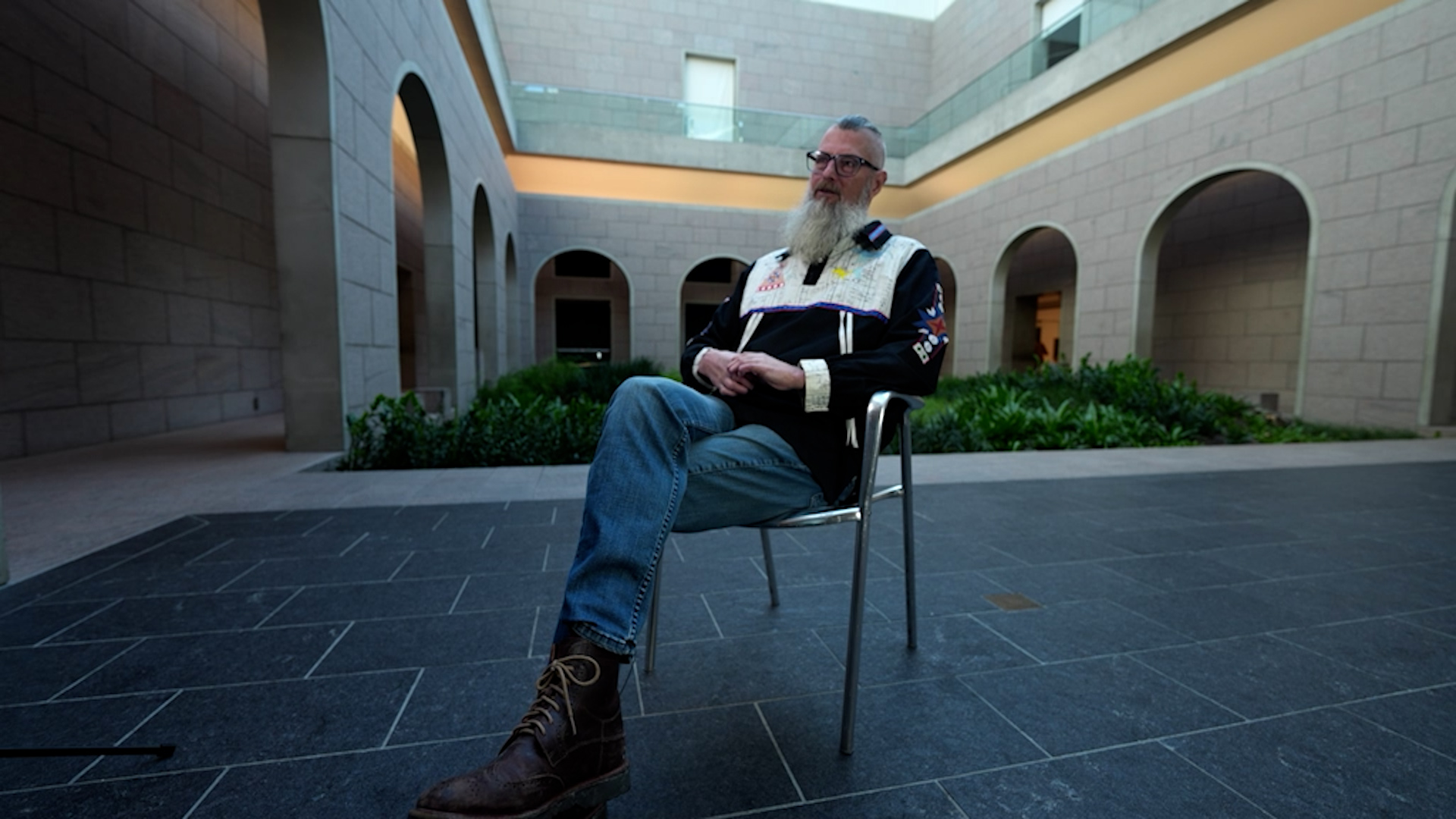 Steven Loft sits in the Garden of the National Gallery of Canada in Ottawa for an interview with The New Reality. He is the vice-president of the new department of Indigenous Ways and Decolonization.