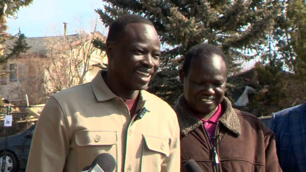 Aleer Deng and Deng Deng Tiordit (L to R), Friends and family of the victims of a Calgary house explosion, speak to media on March 30, 2023.