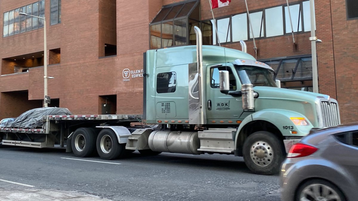 Photo of a trailer truck in downtown Hamilton, Ont. Starting in March 2023, signage will be going up across the lower city and parts of the mountain to indicate the city's new truck route, which restricts trucks with more than four axles from using certain streets.