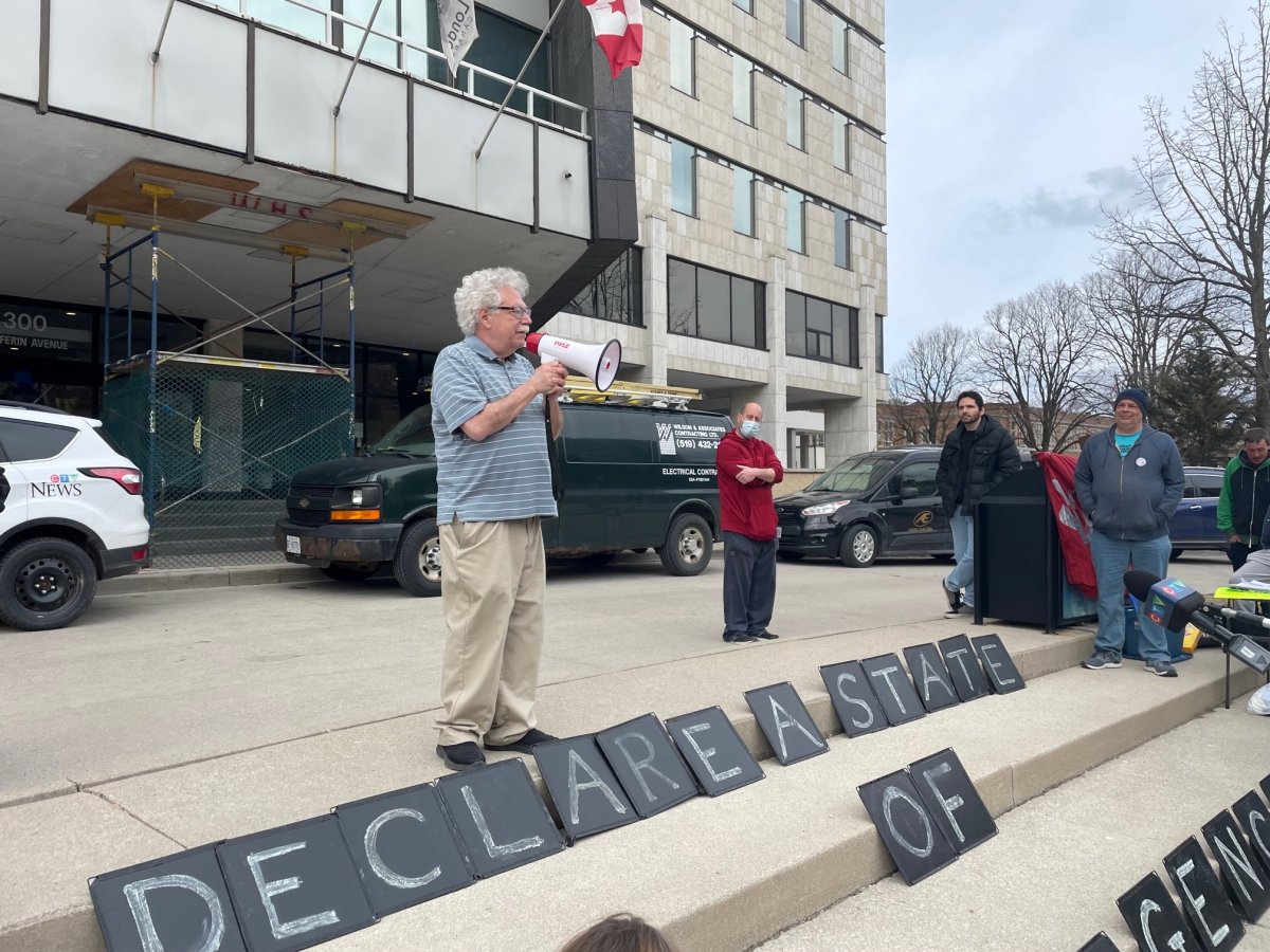 London city Coun. Sam Trosow speaks at a rally at city hall calling on council to declare a state of emergency over housing on March 28, 2023.