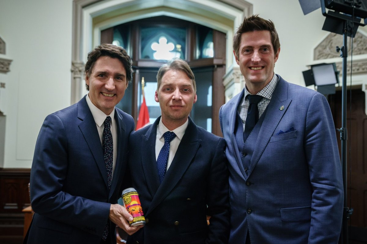 Paddleboard mental health advocate Mike Shoreman with Prime Minister Justin Trudeau and MP Ryan Turnbull