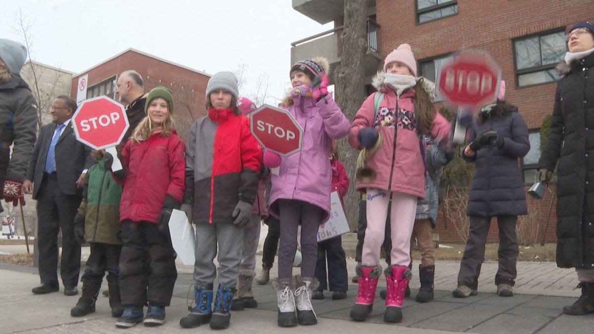 Students demonstrate outside Ecole Hebert for better road safety.