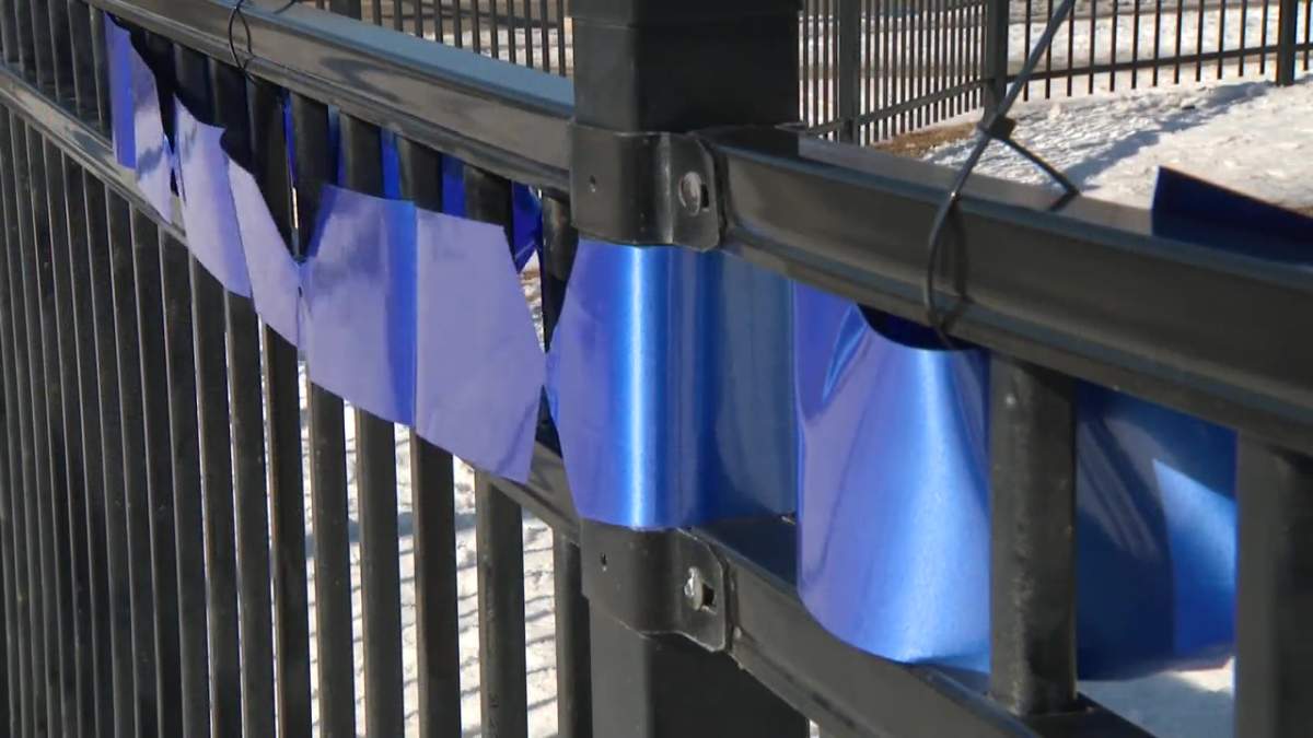 Const. Daniel Woodall School, named after the last Edmonton Police Service officer who died in the line of duty in 2015, strung blue ribbons and changed their school sign in solidarity for Const. Travis Jordan and Const. Brett Ryan, who were killed on the job Thursday, March 16, 2023.