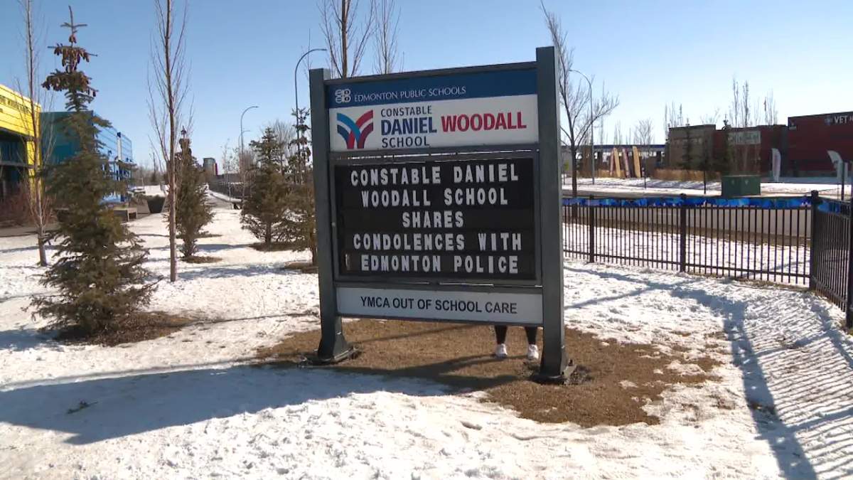 Const. Daniel Woodall School, named after the last Edmonton Police Service officer who died in the line of duty in 2015, strung blue ribbons and changed their school sign in solidarity for Const. Travis Jordan and Const. Brett Ryan, who were killed on the job Thursday, March 16, 2023.