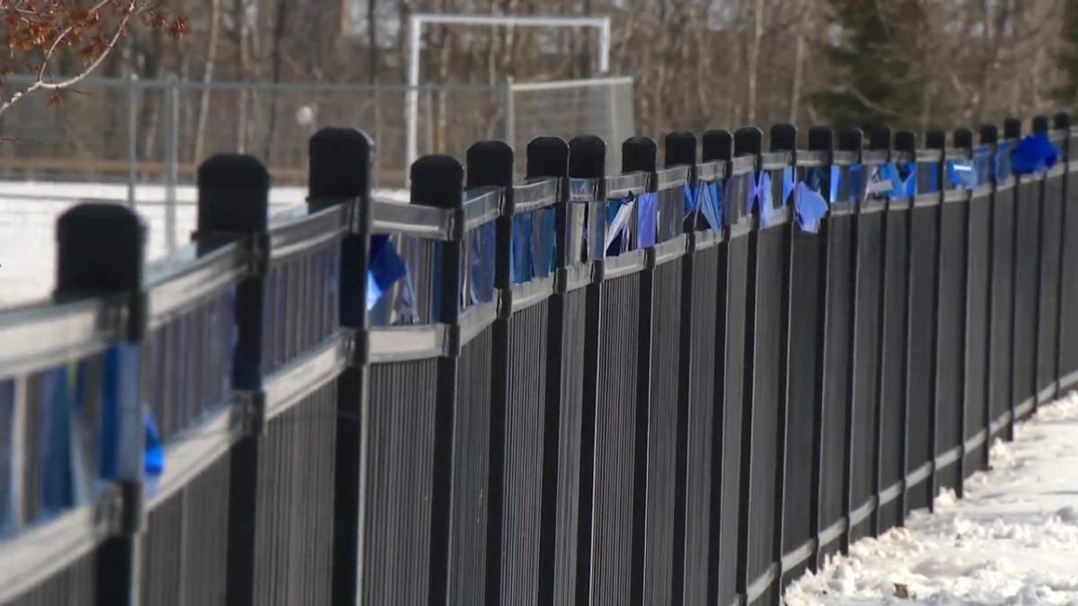 Const. Daniel Woodall School, named after the last Edmonton Police Service officer who died in the line of duty in 2015, strung blue ribbons and changed their school sign in solidarity for Const. Travis Jordan and Const. Brett Ryan, who were killed on the job Thursday, March 16, 2023.
