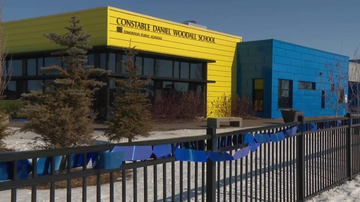 Const. Daniel Woodall School, named after the last Edmonton Police Service officer who died in the line of duty in 2015, strung blue ribbons and changed their school sign in solidarity for Const. Travis Jordan and Const. Brett Ryan, who were killed on the job Thursday, March 16, 2023.