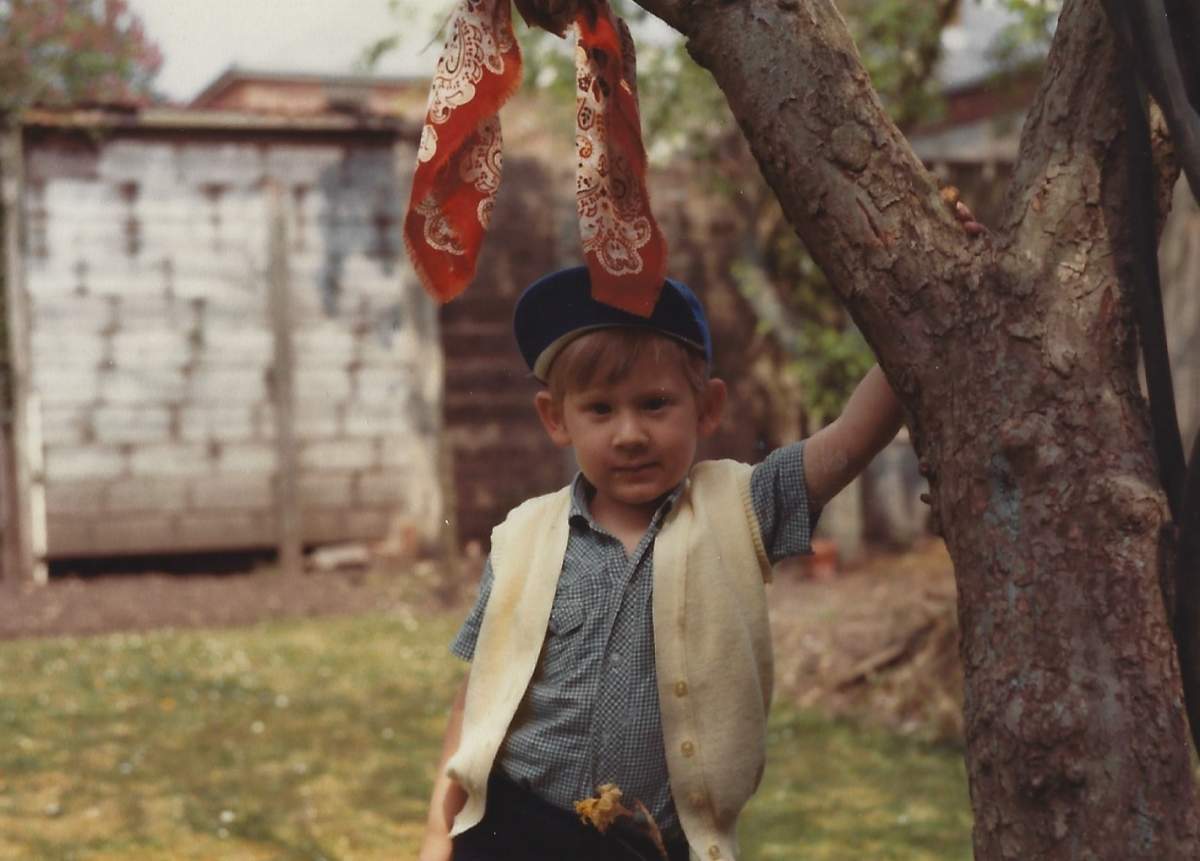 A young Stuart Semple outside his childhood home.