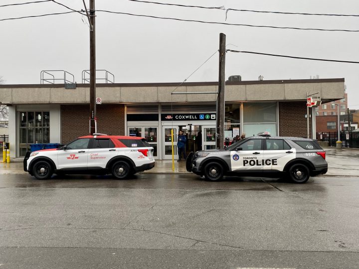 Police at Coxwell Station on Friday after a reported knifepoint robbery during the evening rush.