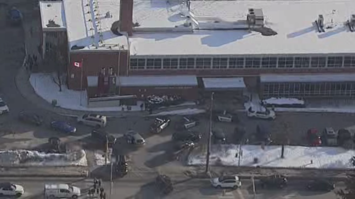 Police cruisers are seen outside of Georgetown District High School on Thursday.