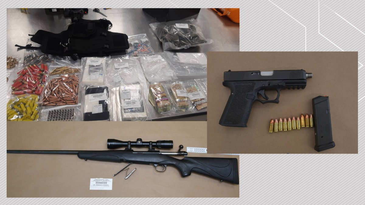 A collection of items, including firearms and drugs, on display following search warrants executed by Calgary police on March 9, 2023.