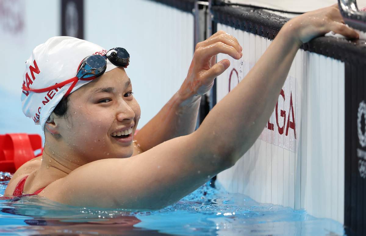 FILE - Margaret Mac Neil of Team Canada celebrates after winning the gold medal in the women's 100-metre butterfly final at the Tokyo 2020 Olympic Games on July 26, 2021.