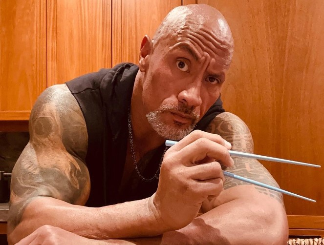 Dwayne "The Rock" Johnson poses with his signature raised eyebrow.