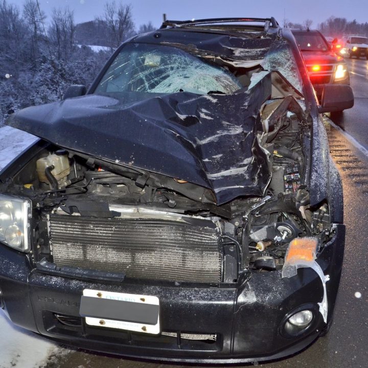 This vehicle was hit by a tire that separated from a truck on Highway 400 Monday morning, police say.