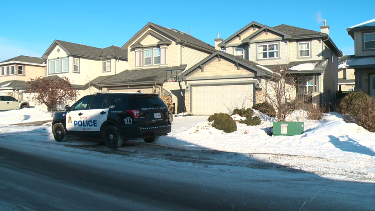 An Edmonton Police Service vehicle outside a house on on Hanna Crescent in the southwest Haddow neighbourhood where a man was found dead Sunday, Mar. 5, 2023.