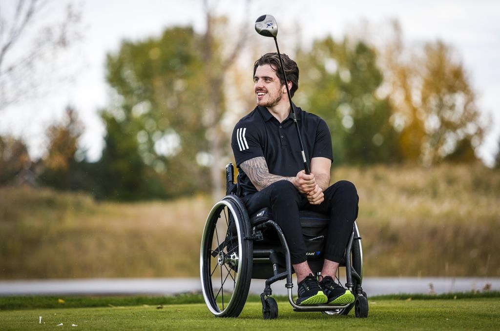Humboldt Broncos bus crash survivor Ryan Straschnitzki pauses during a para golf lesson in Calgary, Tuesday, Sept. 28, 2021.