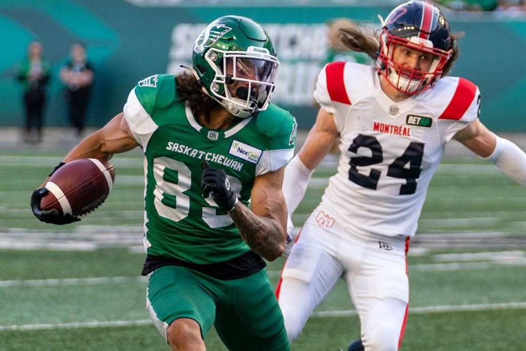 Saskatchewan Roughriders wide receiver Kian Schaffer-Baker (89) runs downfield as Montreal Alouettes defensive back Marc-Antoine Dequoy (24) tries to catch up during second half CFL football action in Regina on Saturday, July 2, 2022. The Roughriders signed Schaffer-Baker to a two-year contract extension through the 2025 season on Wednesday. THE CANADIAN PRESS/Heywood Yu.