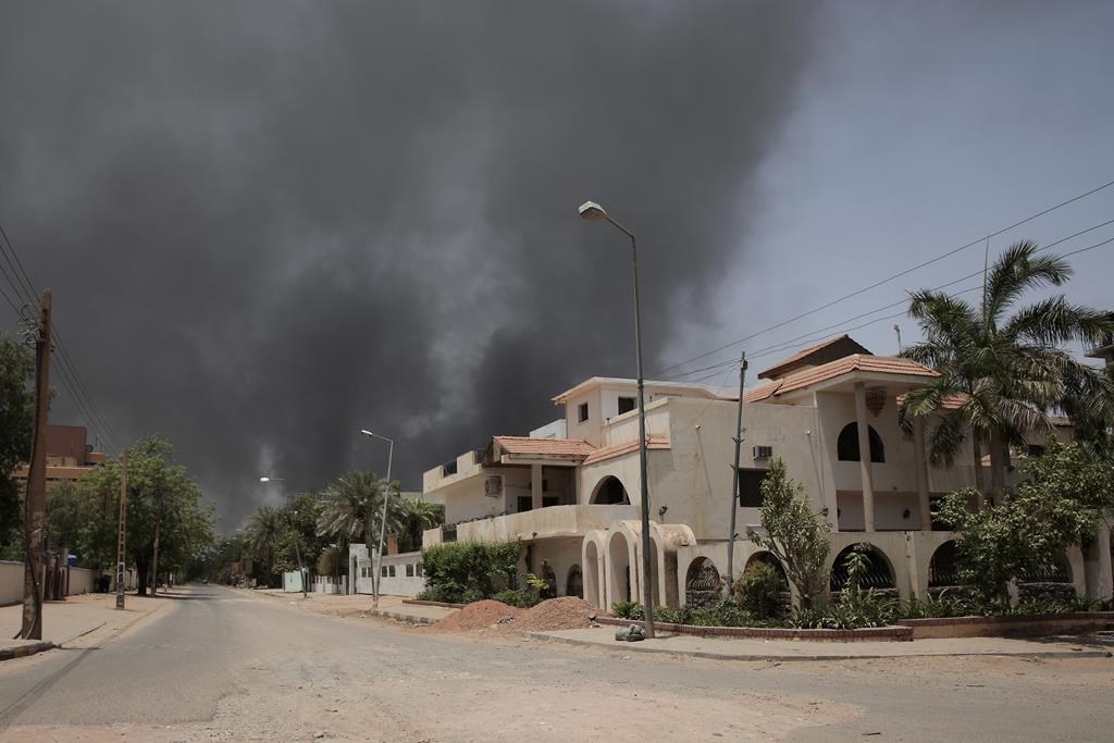Smoke is seen rising from a neighborhood in Khartoum, Sudan, Saturday, April 15, 2023.
