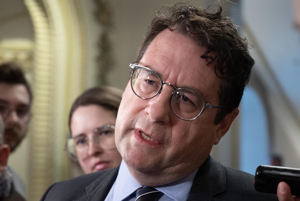 Quebec Education Minister Bernard Drainville responds to reporters' questions, Thursday, April 20, 2023, at the legislature in Quebec City. THE CANADIAN PRESS/Jacques Boissinot.