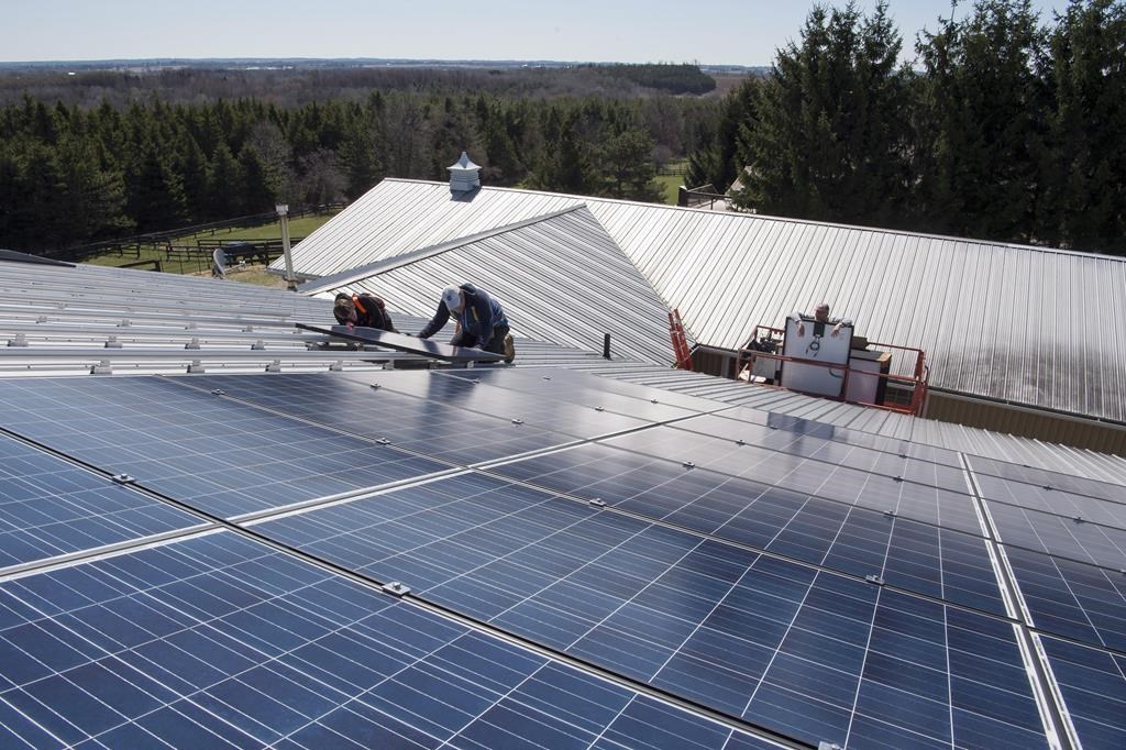 A new solar panel array is installed in Scugog, Ont. on Wednesday, April 27, 2016. A new report says the financial support Canada is offering for the clean energy transition is competitive with the Inflation Reduction Act south of the border.