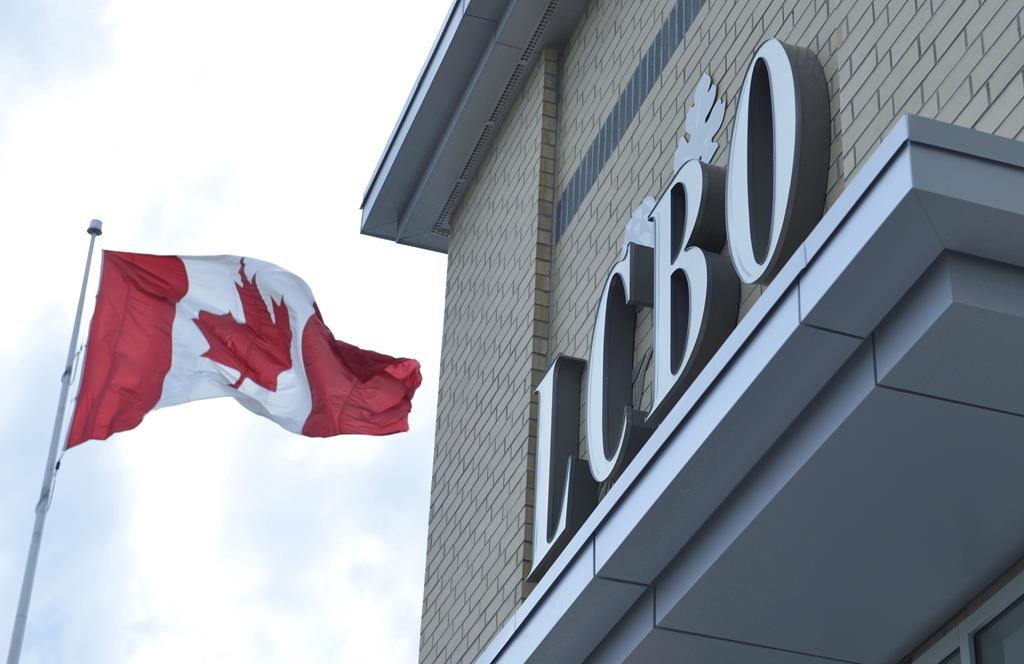 A Canadian flag flies near an under construction LCBO store in Bowmanville, Ont. on Saturday July 20, 2013.