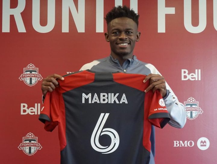 Newly acquired centre back Aime Mabika is shown displaying his Toronto FC jersey at the MLS club’s training facility on Thursday April 27, 2023. Mabika came over in a trade with Inter Miami CF.