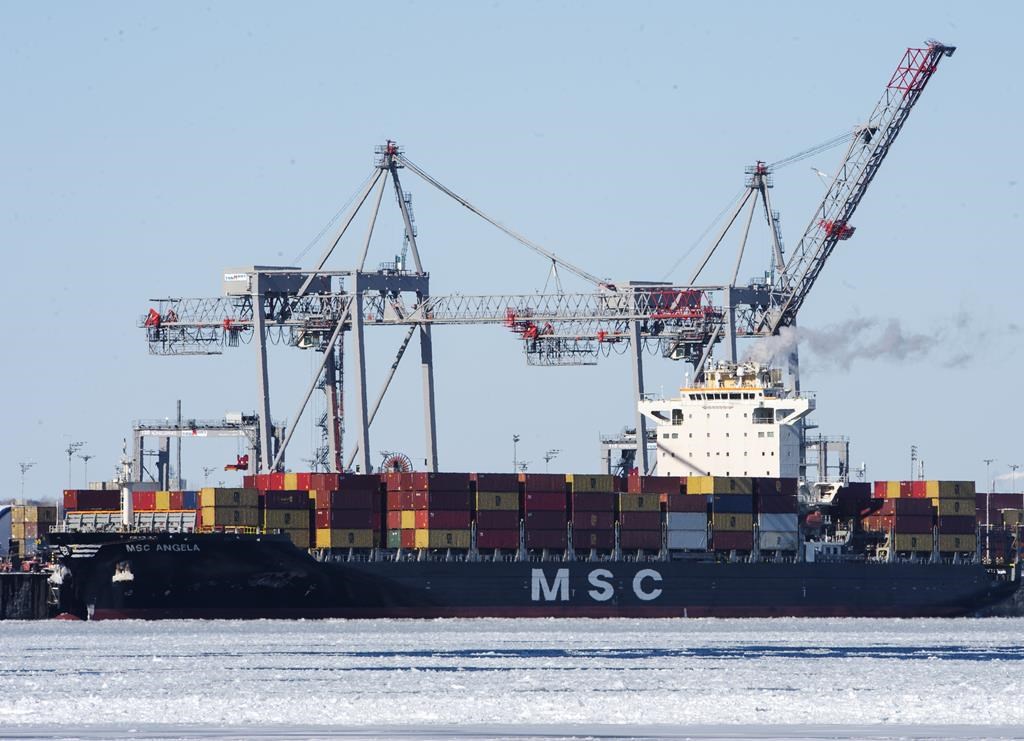 A container ship is docked in the Port of Montreal, Wednesday, February 17, 2021 in Montreal.  
