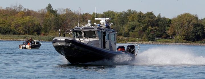 Border Patrol Agents patrol the Niagara River near the international border with Canada in Buffalo, N.Y. on Oct.6, 2011. A U.S. law enforcement agency says three Mexican migrants have been sent back to Canada after they attempted to cross into New York state on a rail bridge from Ontario. 
