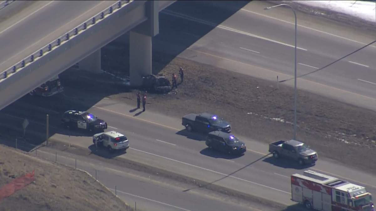 Emergency crews attend a fatal collision on Highway 22X in the southwest corner of Calgary, on April 6, 2023.