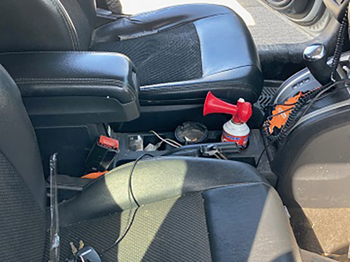 A photo of the Jeep’s centre console, with part of the pistol partially visible.