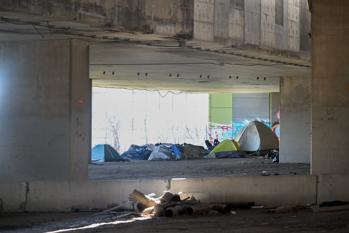 A homeless camp is shown beneath an overpass in Montreal, Friday, April 14, 2023. The Quebec Superior Court has granted a temporary 10-day injunction to halt the dismantling and eviction of a homeless encampment located underneath a major Montreal highway. 