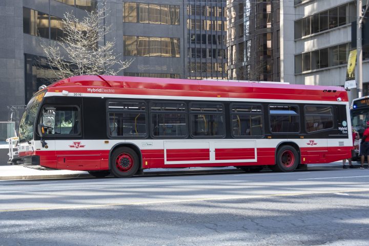 A TTC hybrid electric bus is seen waiting on University Avenue in Toronto on Sunday, May 24, 2020. 