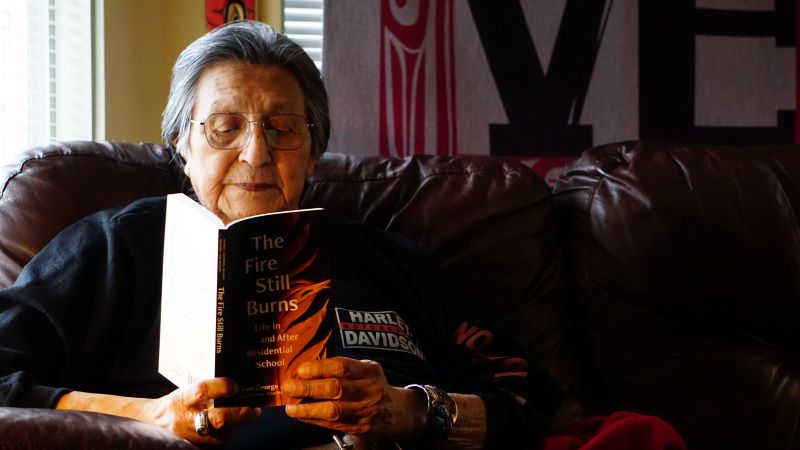 Elder Sam George reads from his new memoir, The Fire Still Burns, at his home on unceded Sḵwx̱wú7mesh Úxwumixw territory in North Vancouver on Thurs. April 20, 2023.