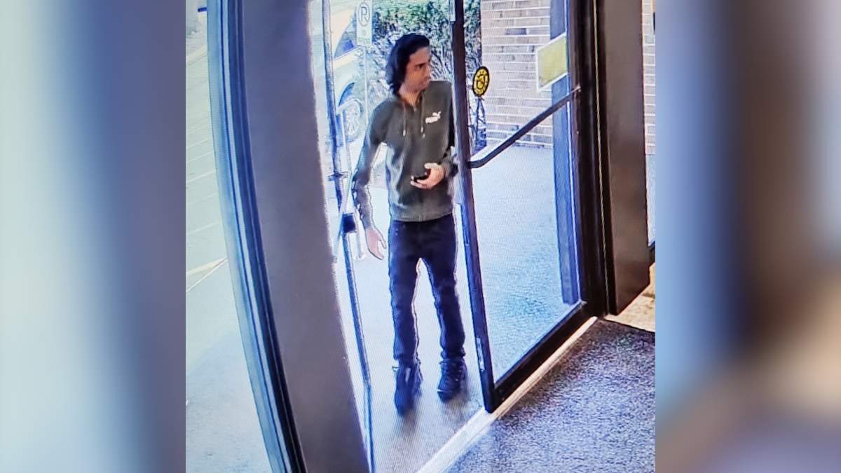 Police say the suspect showed up at the victim's apartment building after an "unknown man" made a fraudulent call regarding her grandson.