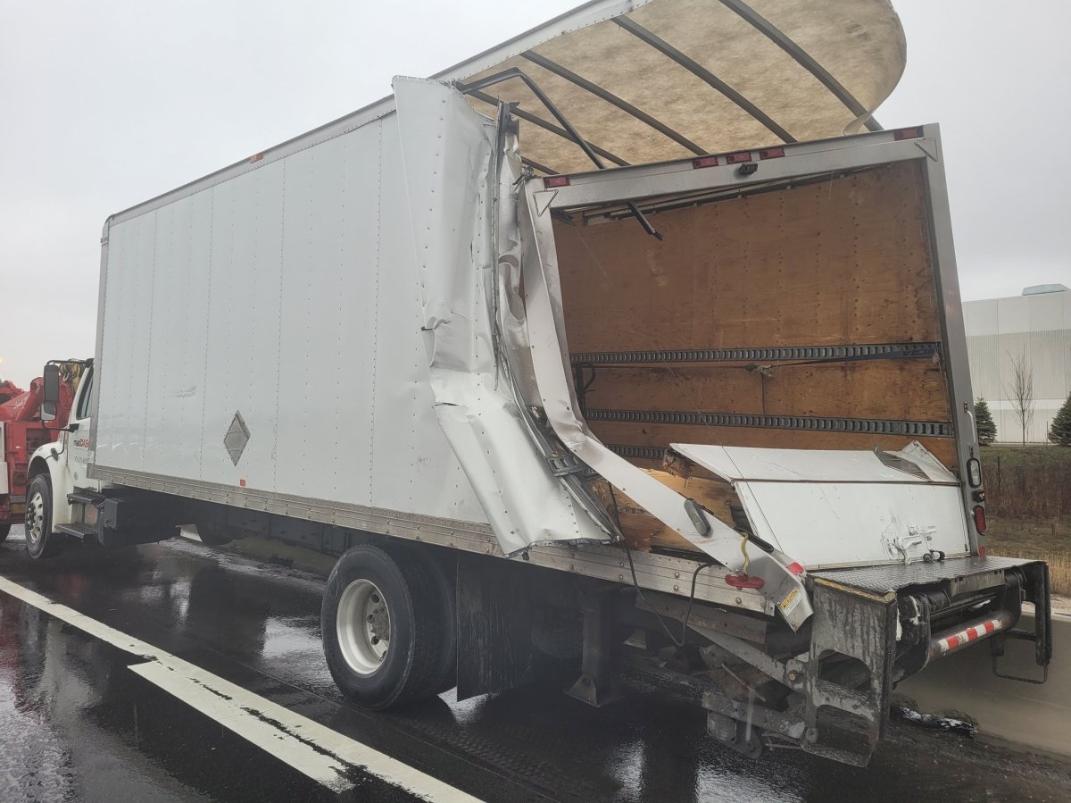Police say no one was injured after a transport truck struck another along Highway 401.