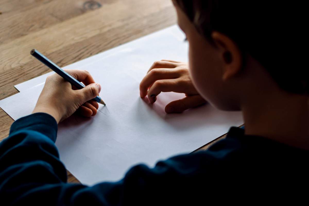 File photo of a child drawing on a piece of paper.