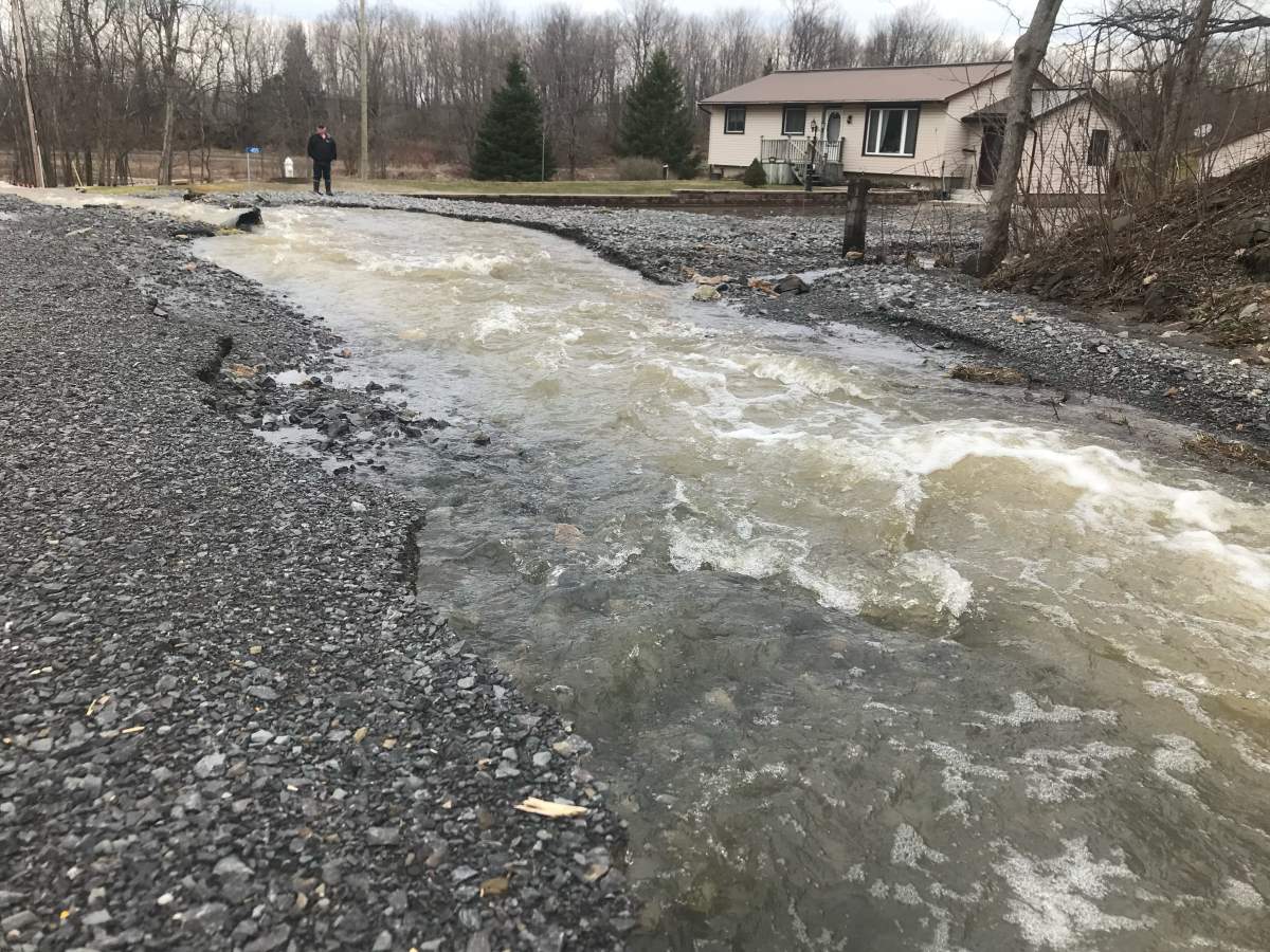 A road is washed out off of Highway 32 north of Gananoque, Ont.