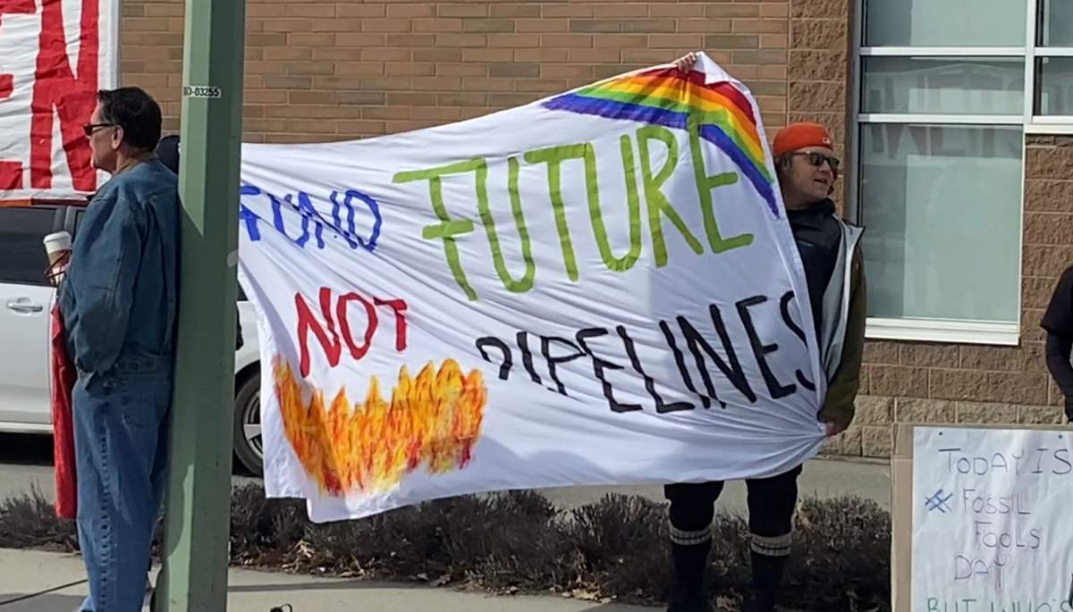 A crowd of around 20 people gathered in Kelowna, B.C., on Saturday for a rally against fossil fuels.