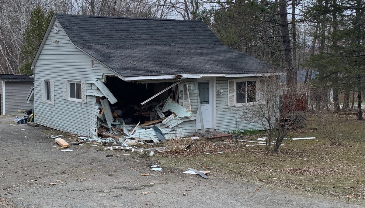 A house in the Fredericton area was extensively damaged after a car crashed into it Wednesday morning.