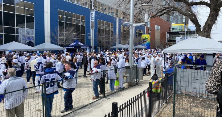 Jets fans flood Winnipeg’s Donald Street in a sea of white for epic whiteout street party