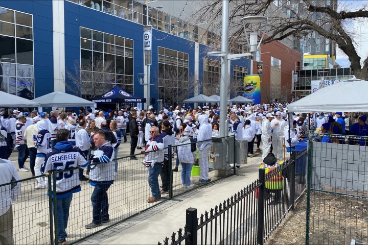Jets fans flood Winnipeg’s Donald Street in a sea of white for epic whiteout street party