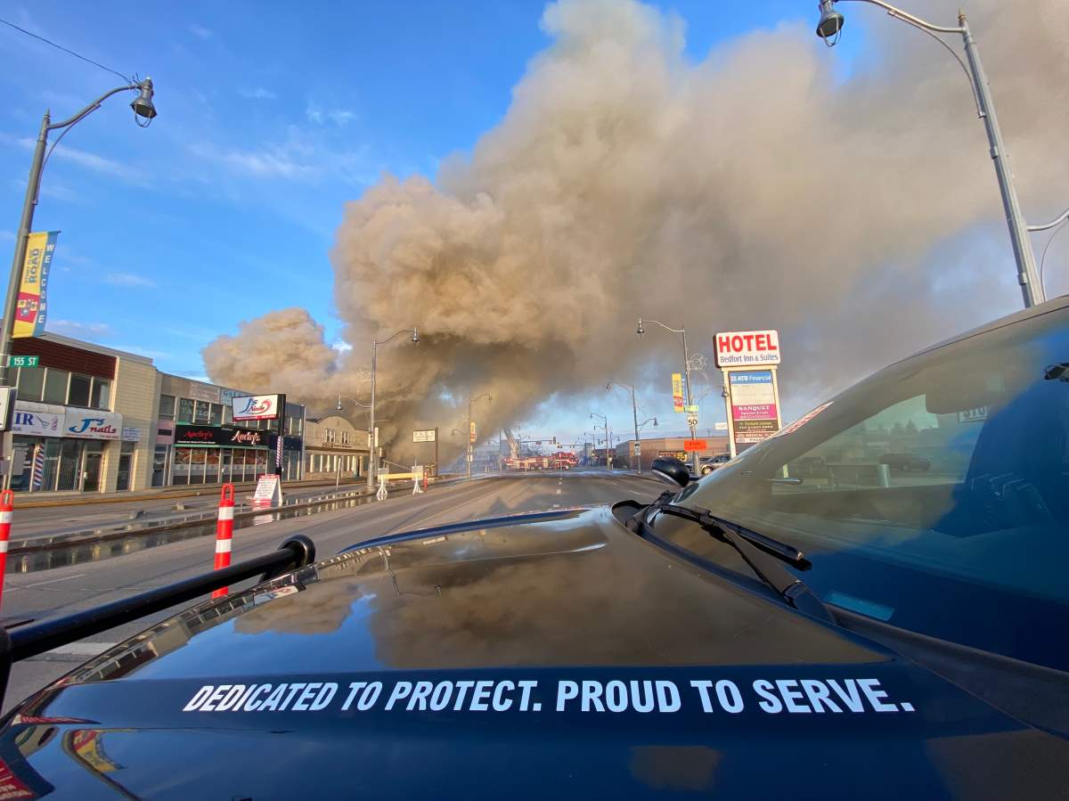 Fire burns at commercial building on Stony Plain Road and 156 Street in Edmonton on Friday, April 14, 2023.