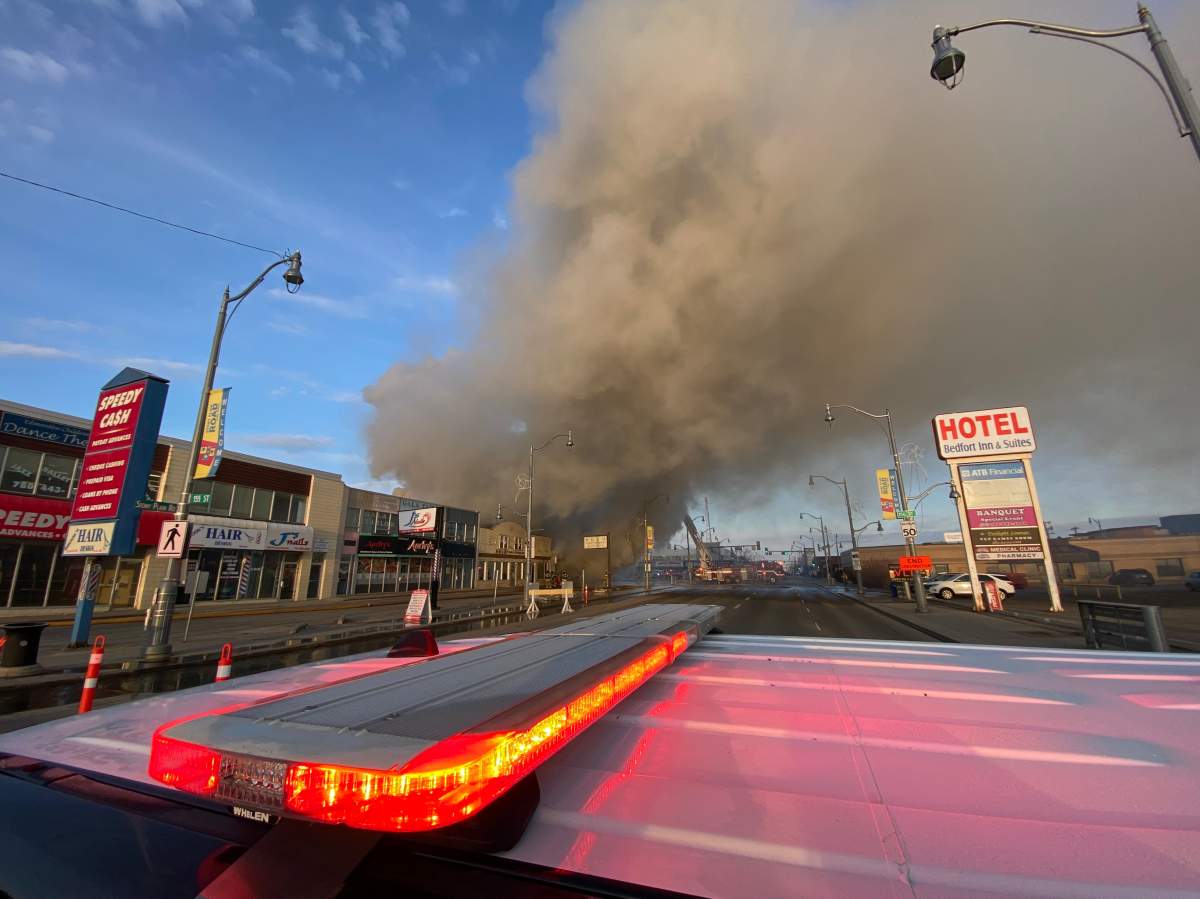Fire burns at commercial building on Stony Plain Road and 156 Street in Edmonton on Friday, April 14, 2023.