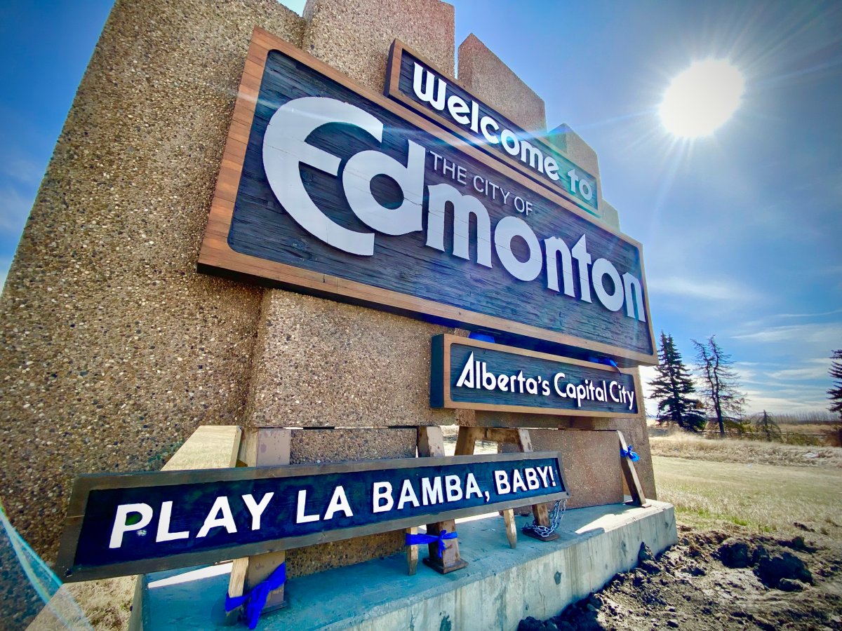 A sign bearing the words, "Play La Bamba, Baby" now sits where the "City of Champions" slogan greeted drivers for years when driving into Edmonton on the QEII highway. April 26, 2023.