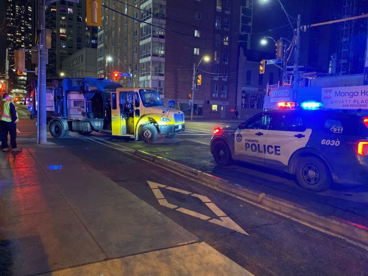Toronto police say a garbage truck struck a female pedestrian.